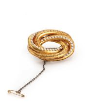 A cased Victorian Etruscan revival, split pearl knot brooch, c.1870,