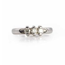 A white gold three stone diamond ring,