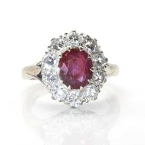 A white gold ruby and diamond oval cluster ring,