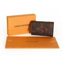 A Louis Vuitton monogrammed canvas six key holder,