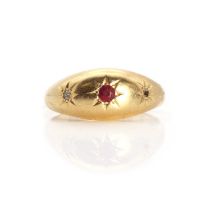 An 18ct gold three stone ruby and diamond star set gypsy ring,