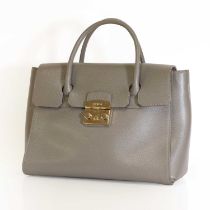 A grey Furla handbag,