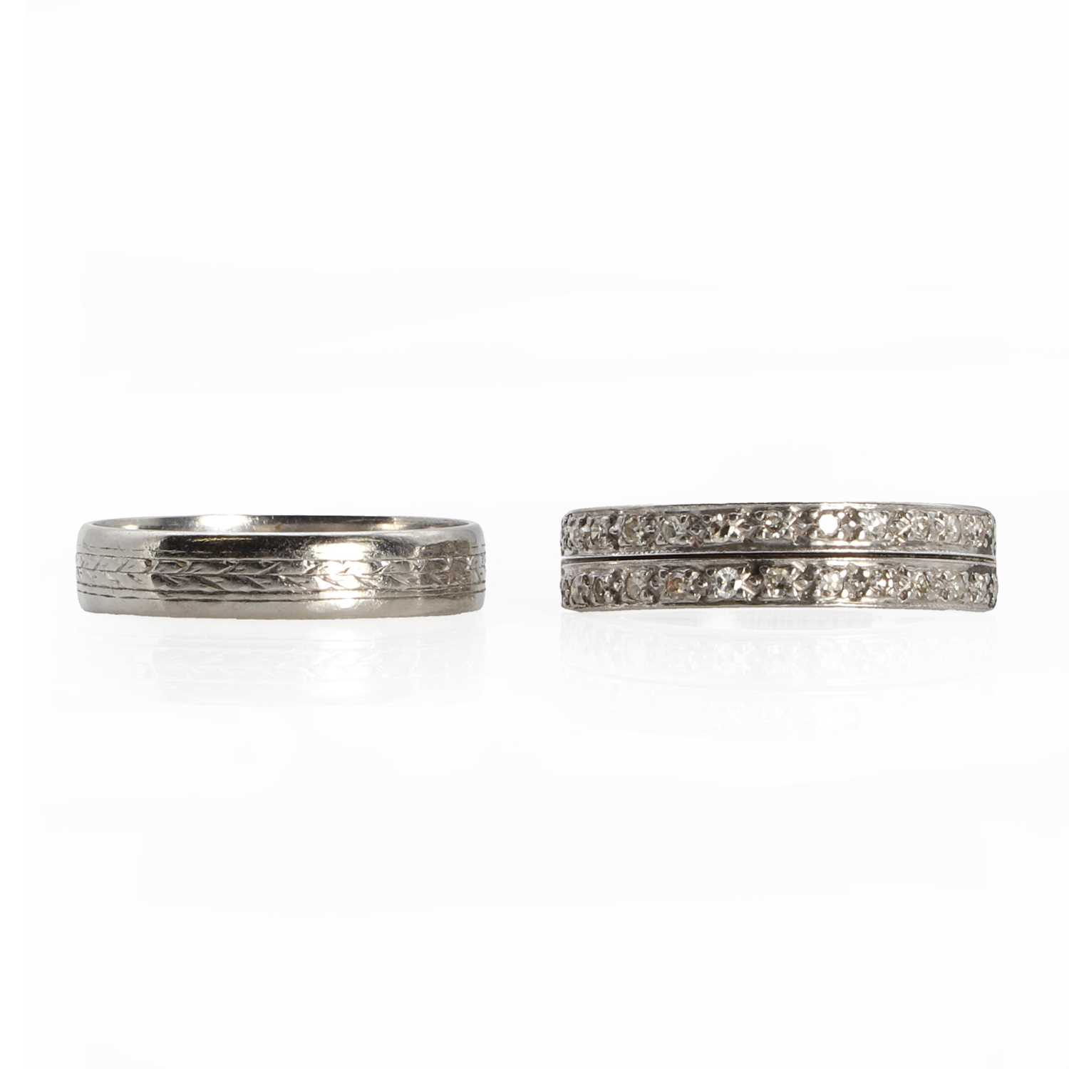 A white gold diamond half eternity ring and a platinum wedding ring,