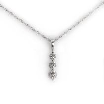 A three stone diamond pendant with chain,