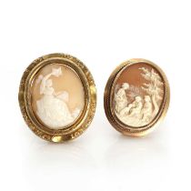 A cameo brooch depicting a country scene, and another with a seated figure,