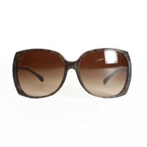 A pair of Chanel brown framed sunglasses,