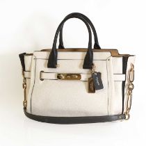 A Coach cream pebbled leather swagger satchel,