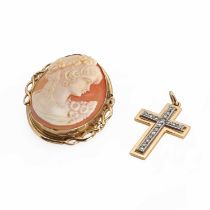 A gold diamond cross pendant and a gold shell cameo pendant/brooch,