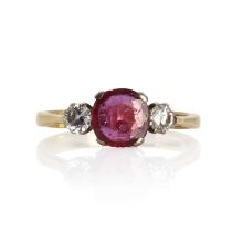 An 18ct gold ruby and diamond three stone ring,