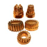 A collection of five Victorian copper jelly moulds