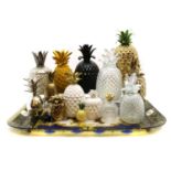 A collection of pottery and glass pineapples