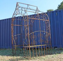 A wrought iron garden conversation seat or arbour seat