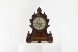 A Victorian carved bracket clock,