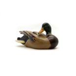 A carved and painted duck decoy,