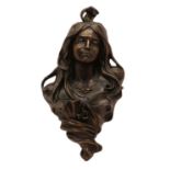 An Art Nouveau style spelter wall hanging