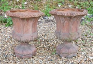 A pair of Gothic style terracotta urns