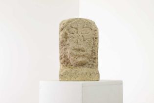 A carved limestone head,