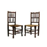 A pair of ash and beech spindle back chairs