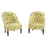 A pair of upholstered low chairs,