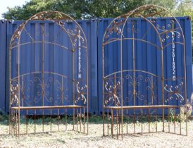 A pair of wrought iron arbour seats