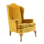 A Queen Anne-style wingback armchair