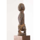 A Baule carved hardwood figure,