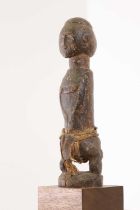 A Baule carved hardwood figure,