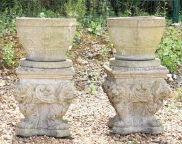 A pair of composite stone planters