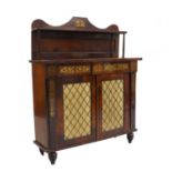 A rosewood and brass chiffonier