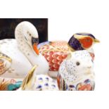 A collection of Royal Crown Derby porcelain paperweights