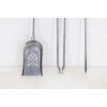A set of three polished steel fire irons,