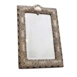 A late Victorian silver mirror,