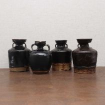 A collection of four Chinese black-glazed jars,