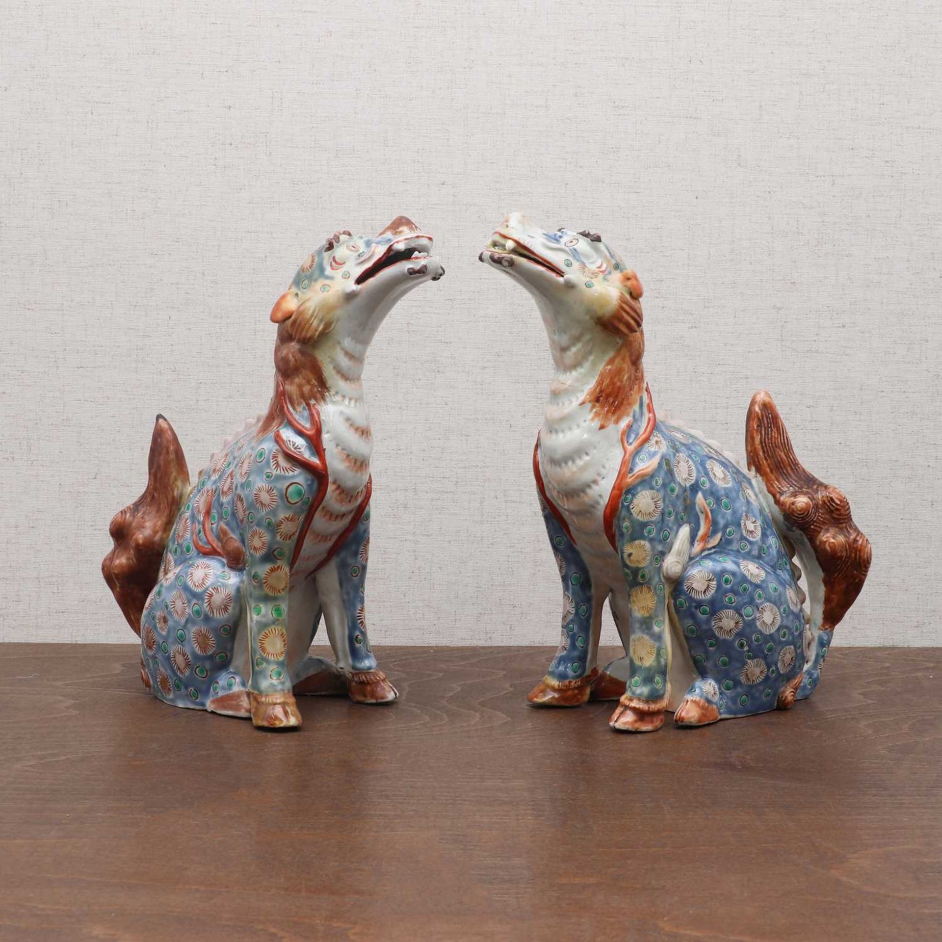 A pair of Japanese Kakiemon-type okimono,