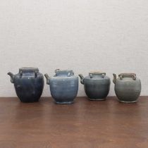 A collection of four Chinese blue-glazed jugs,