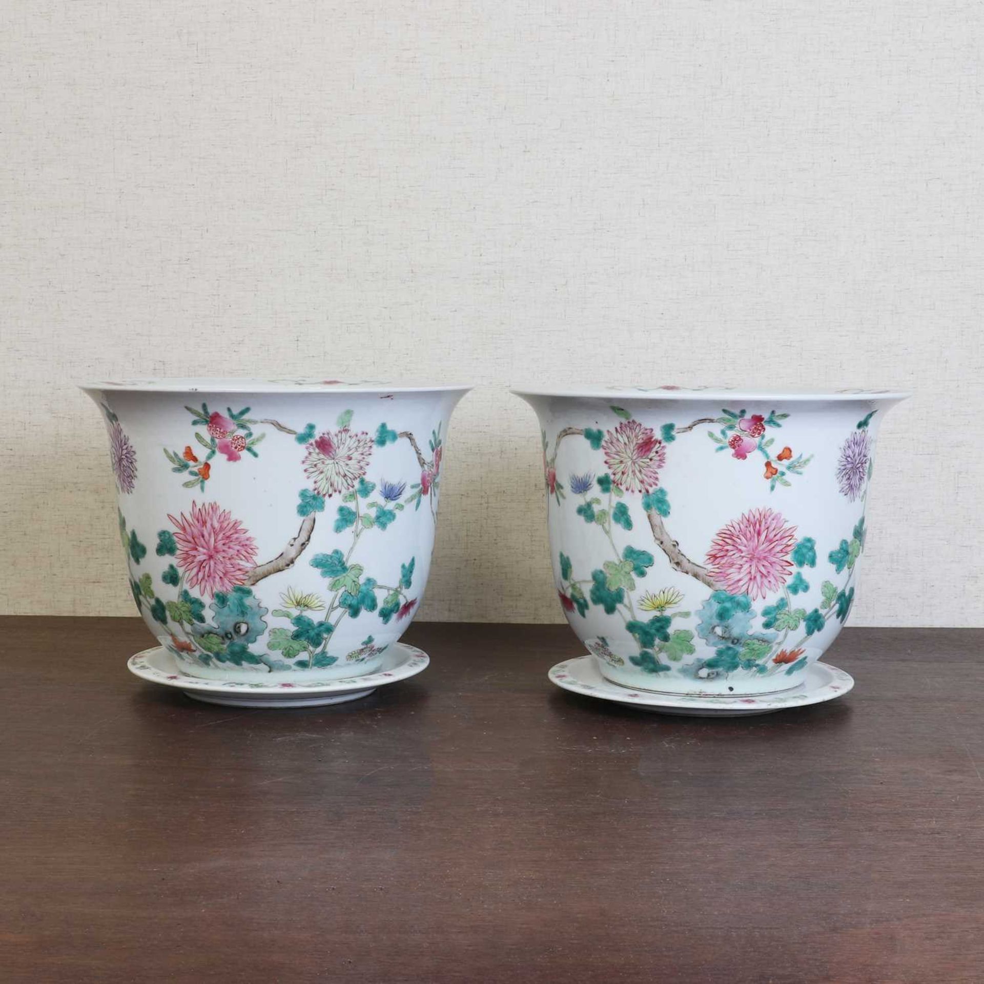 A pair of Chinese famille rose jardinières with stands,