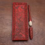 A Japanese lacquered brush and cover,