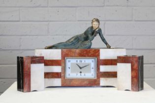 An Art Deco onyx and marble clock garniture,