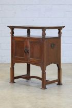 An Arts and Crafts copper and oak side cabinet,