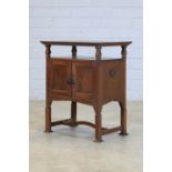 An Arts and Crafts copper and oak side cabinet,