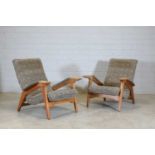 A pair of beech reclining lounge chairs,