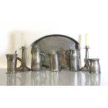 A collection of Arts and Crafts pewter items,