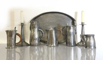 A collection of Arts and Crafts pewter items,