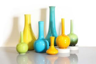 A collection of seven Burmantofts Pottery coloured vases,