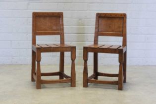 A pair of Thomas 'Gnomeman' Whittaker oak side chairs,