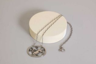 A sterling silver kneeling deer necklace by Georg Jensen,