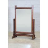 An Arts and Crafts oak dressing mirror,