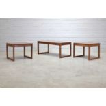 A set of three rosewood side tables,