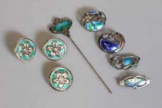 A group of Arts & Crafts silver and enamel Cymric jewellery by Liberty & Co.,