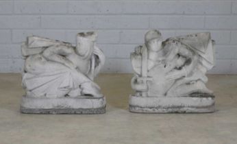 A pair of carved stone figures,